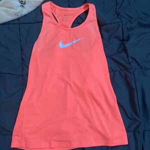 Medium Women’s orange Nike tank.